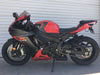 red and black Suzuki GSXR 600 with Racing 905 race rails