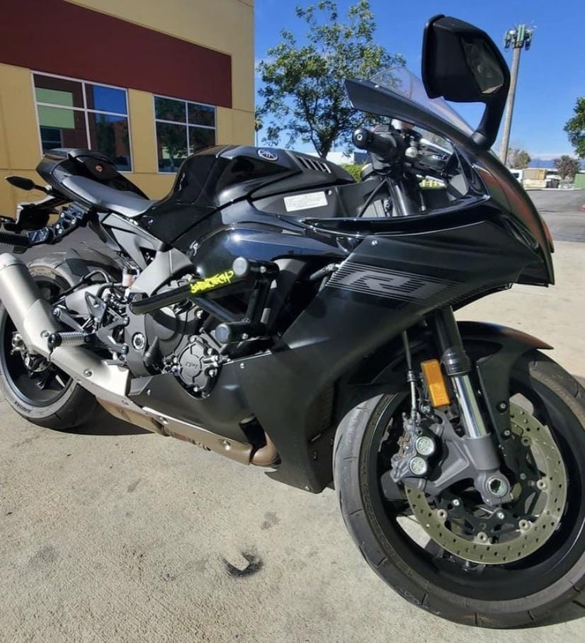 black Yamaha YZF R1 with race rails